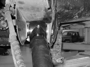 Figure 6c 16. Locate the existing center hole in the outside of the OE track bar mount on the driver s side of the vehicle. Drill hole this hole out to ½ (Fig 7). 17.