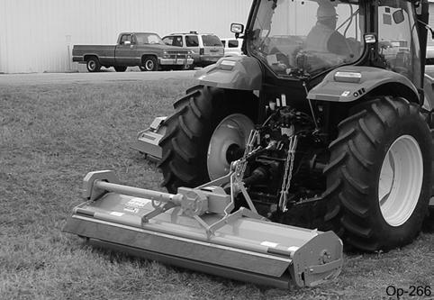 Immediately idle the engine speed and disengage the PTO. Wait for all mower rotating motion to stop, then raise the mower and move the tractor and implement off the object.
