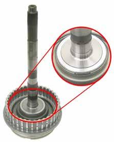 To remove the retaining snap ring from the OD clutch piston return spring assembly (figure 9), you can use: an A4LD/5R55E rear ring gear (for the low/reverse
