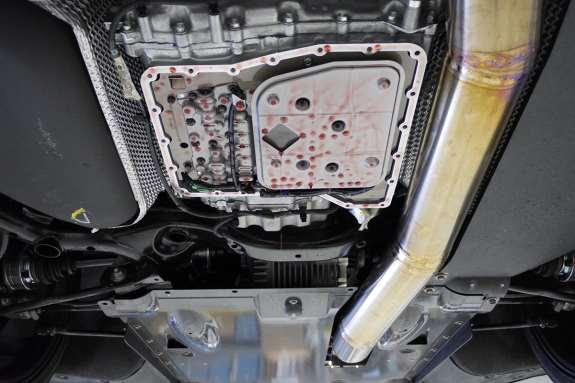 3. Remove transmission oil pan by loosening the M6(10mm head) bolts around the perimeter. Support the pan while removing as it can fall.