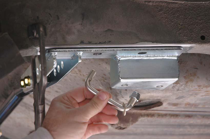 21. On one end of each square-corner u-bolt, install a 3/8 fl at washer and