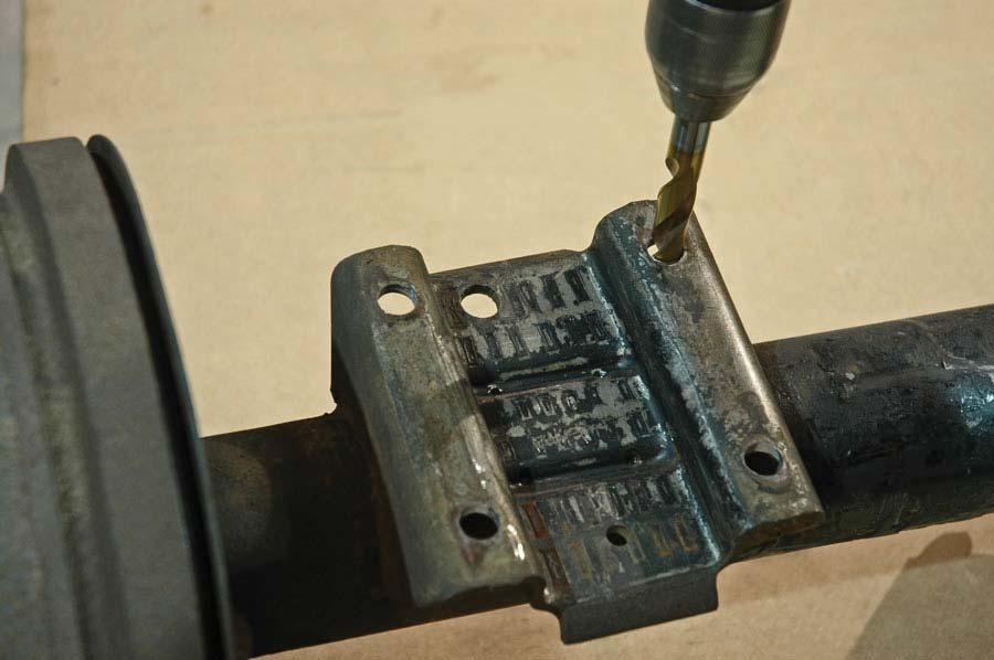 35. Use a 1/2 diameter drill bit to enlarge the holes in the factory