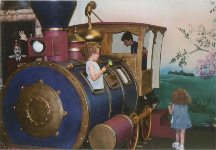 Slide 3 The train on opening day, 2003. As you can see, children quickly figured out that giant model trains are FUN! It was never used as a reading nook.