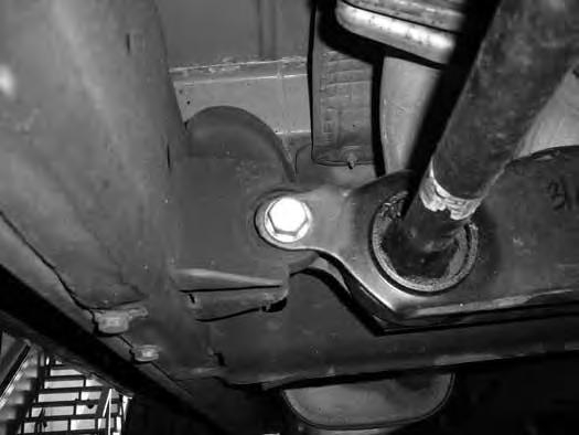 Figure 2 10. Remove the torsion bars by pulling them rearward out of the lower control arms. Set the torsion bars aside. 11.