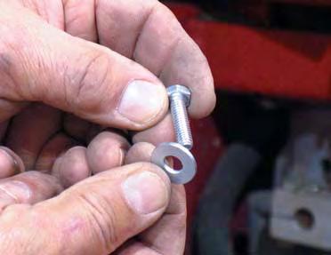 Slide the linkage rod against the allen screw and