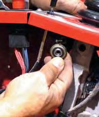 Place a shoulder washer in the outside linkage rod ball joint.