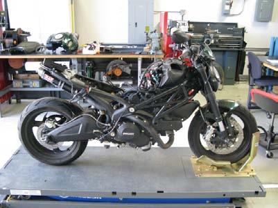 Begin the installation by removing the following components: seat, fuel tank covers