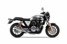 bobber styles. Low-slung clip-on bars, radial master cylinder, and short tail section give it the café racer edge.