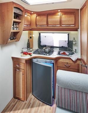 ADVANTAGES Inside Traditional wooden style with a hint of modernity NEW AND CONVENIENT Fixed island bed with wardrobes you can access from outside (awning side) USB charging sockets in bedroom to