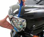 STEP 3 Remove the headlight frame using a