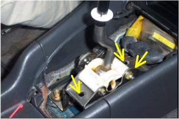 Remove shift knob and plastic cover from shift assembly. 2.