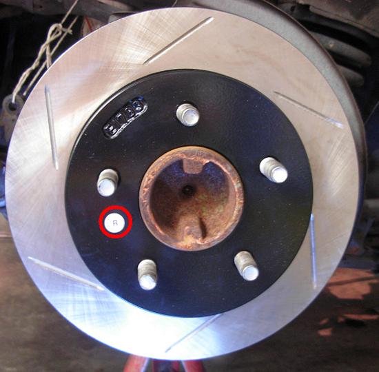 PowerSlot rotor installed on wheel hub. Notice the circled white R sticker is facing out. 11. Peel off the white R (or L ) sticker.