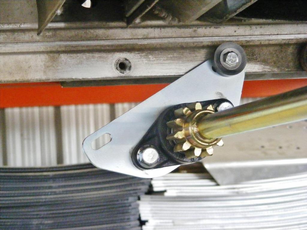 cannot be used. Shown below is a shaft assembly the rearmost cylinder bracket mounting hole. Notice that another hole must be marked and drilled.