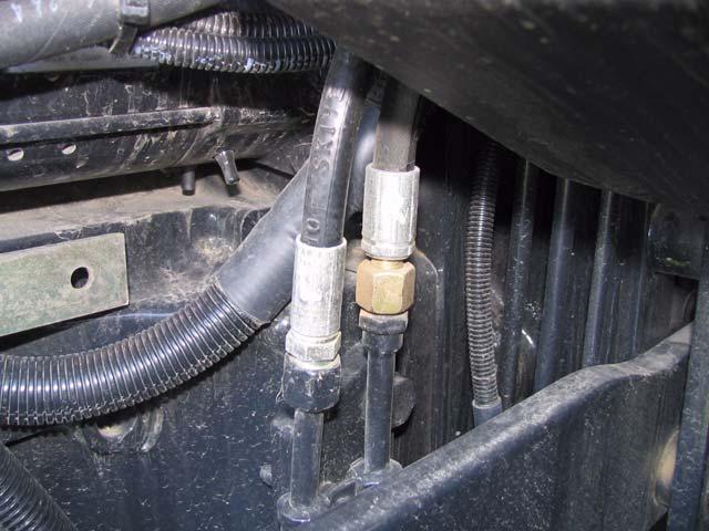 7.6 Connect the AutoFarm Steering Lines to Tractor Identify the hose connections for right and left steering lines on the tractor as shown in the figure below.