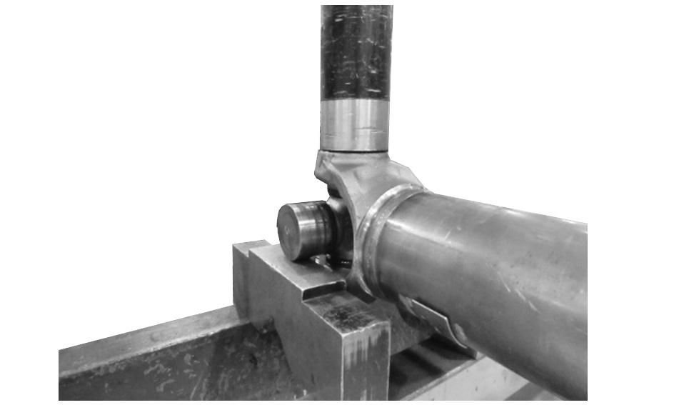 00 and 9:00 o clock. 3. Use a piece of tubing with an inside diameter greater than the outside diameter of the bearing cup to press the bearing from the yoke.