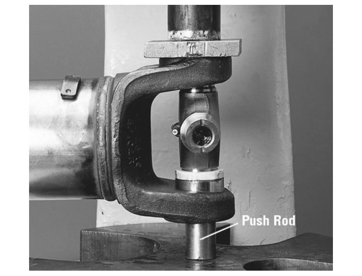 This could result in bearing cup assembly rotation in the yoke. 2. Position the u-joint into the yoke with the grease zerk fitting inward toward tubing.