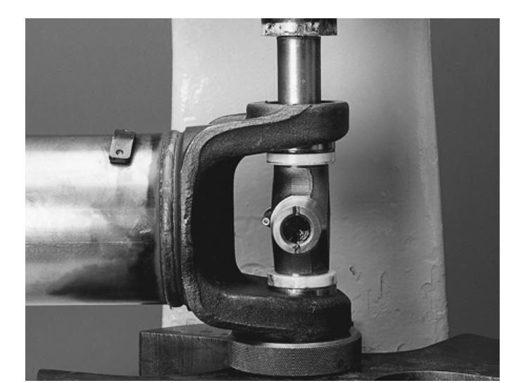 Place a push rod that is smaller than the diameter of the bearing cup under the bearing cup assembly and continue to press into the yoke until far enough to