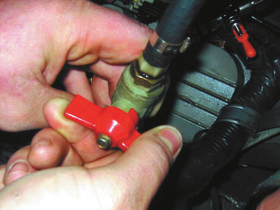 (b) FIGURE 8 Shutoff valves must be used on vehicles equipped with plastic fuel lines to isolate the cause of a pressure drop in the fuel system.