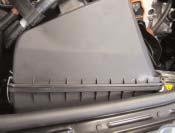 1). Pull the intake channel off the air filter box. Pull the cover upwards and off.