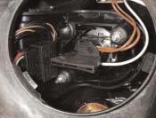 Loosen the safety clip of the xenon bulb and replace the bulb.