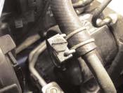 Indicator (driver side): To reach the indicator bulb better, loosen the hose clip and turn clockwise through 90 (see Fig. 11).