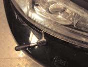 46 4 5 6 The lower fastening screw is located between the headlight