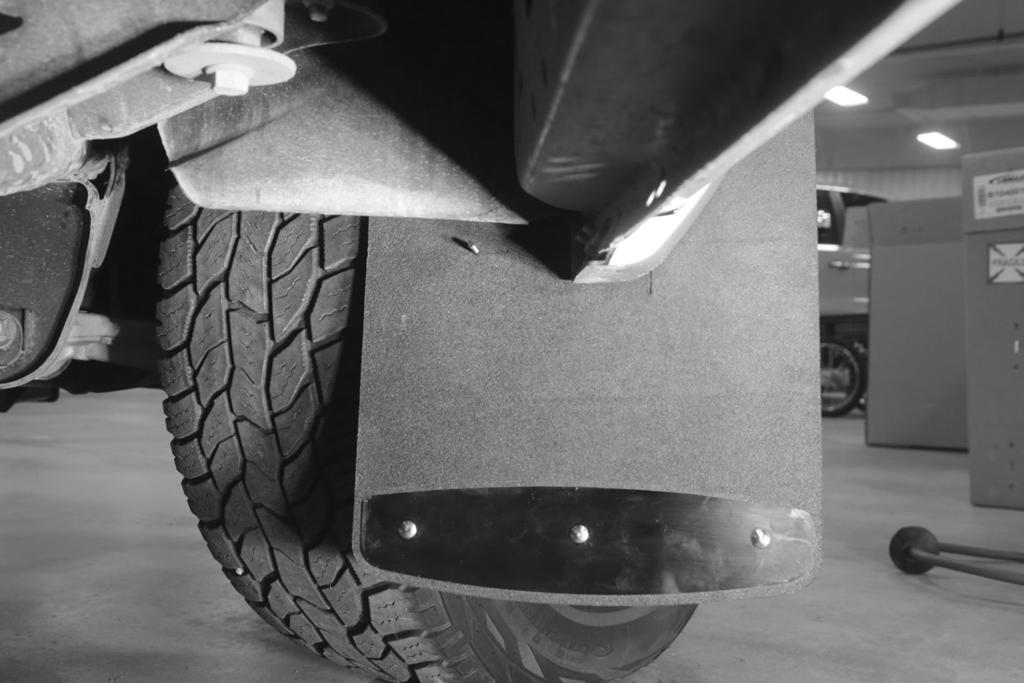 2. INSTALLING MUD FLAPS TO FRONT (Continued) F. From behind the mud flap, determine the stabilizing bracket mounting position.