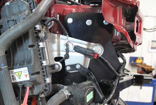 The photo shows the recommended installation of the cables to frame of vehicle.