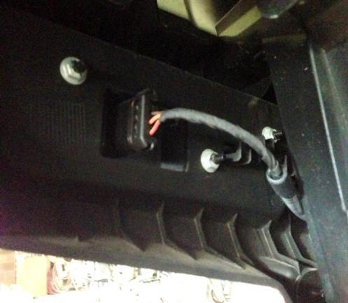 On 2014 models install the red wire to the drivers side and connect the black extension wire to