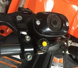 12. Using a 5 mm Allen wrench for top of bolt (L) and a 10 mm wrench for base nut remove four bolts from base handle bars from steering column and handlebar bracket as shown. 13.