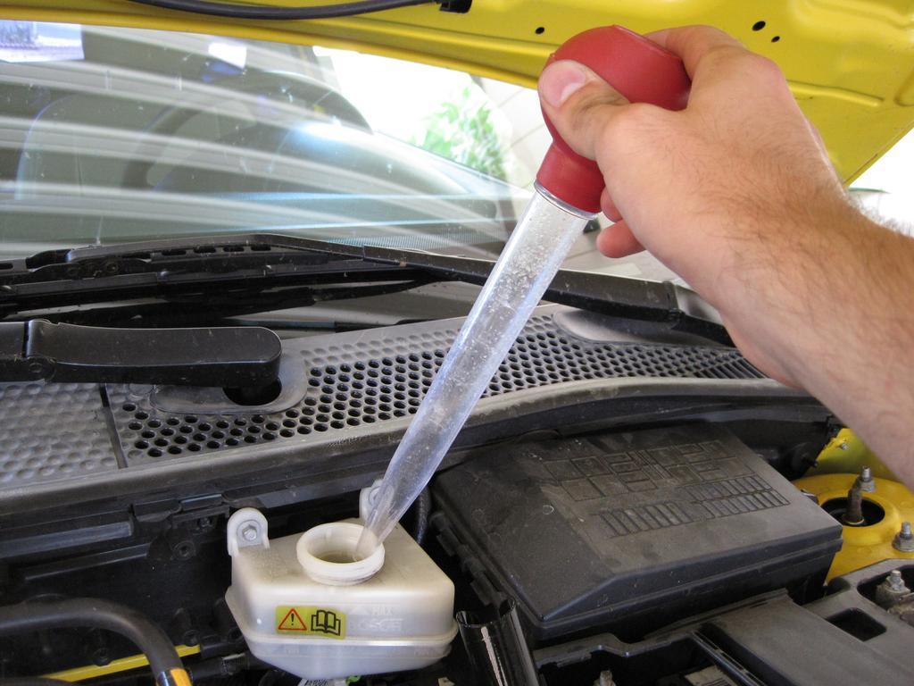 Step 7 Use a turkey baster to remove 2-3 ounces of brake fluid from the reservoir.