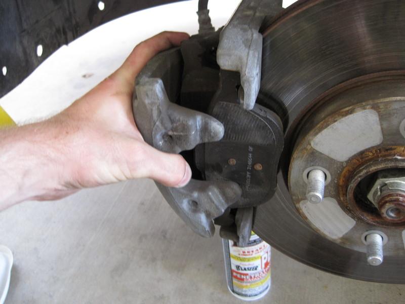 Step 12 Pull the caliper off of the rotor.