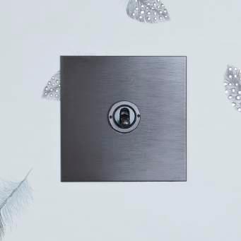 Many of the early light switches were made in bronze and the finish became very
