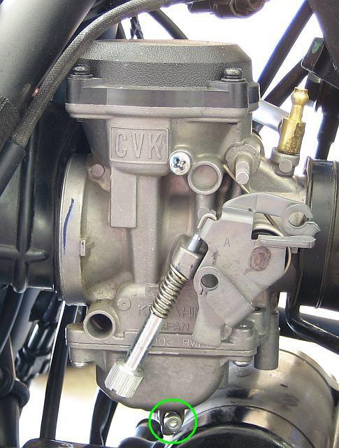 21 20) Get a 3 mm socket head ( Allen ) wrench, and take the carb over to the gas