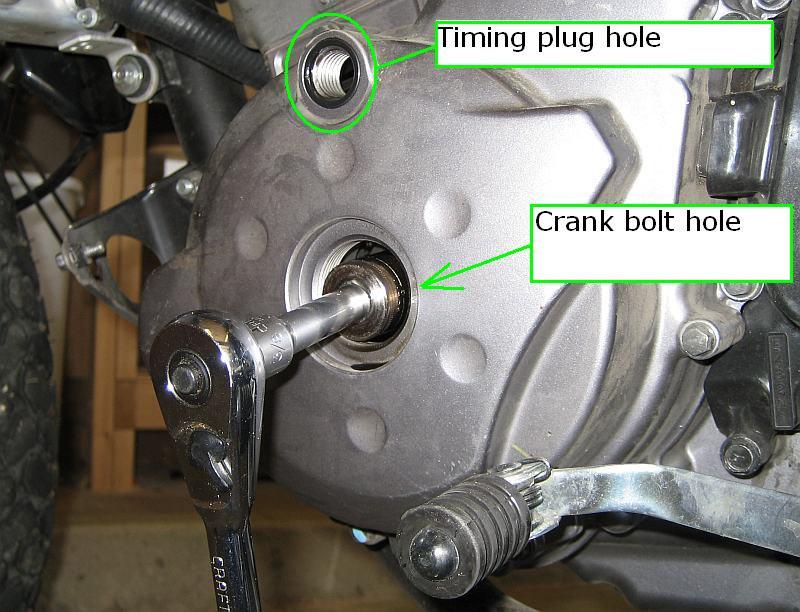 30 35) Now, we need to get the cams crankshaft to TDC. Remove the timing plug (top) and rotor bolt plug. I put a quarter in the slots, and turned it loose with a regular old slip-joint pliers.