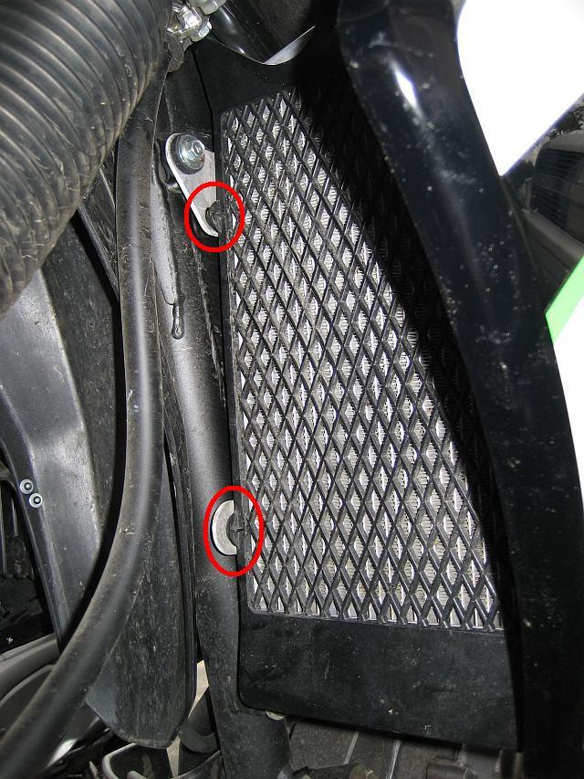 4 When that last bolt, note that this bolt also holds on the grille which covers the radiator.