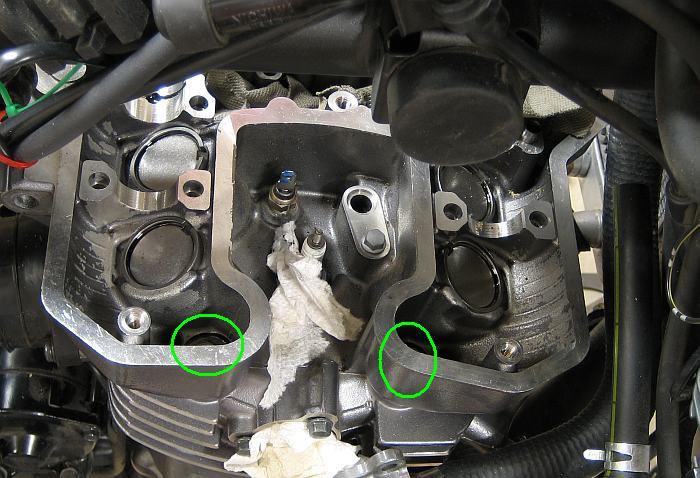 Remove the four cylinder head bolts inside the cylinder