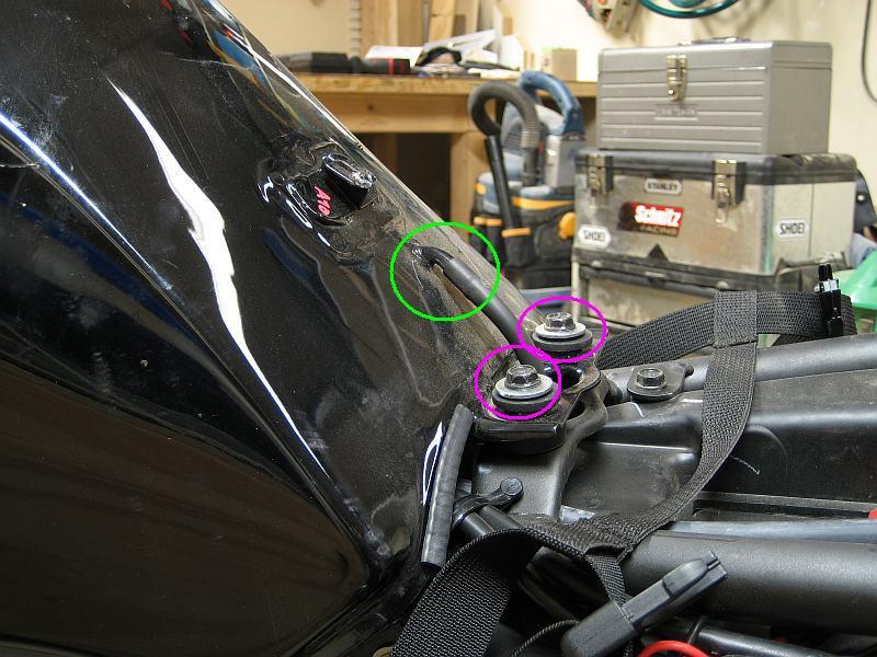 8 5) After turning off and disconnecting the petcock, remove the drain hose (green) and the fuel tank bolts (pink) these are 10mm.