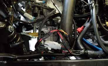 Installation Install Chassis Harness 1. Raise the cargo box. 2. Attach the chassis harness to the power plug (B) and data plug (A) on the inside of the passenger side frame rail.