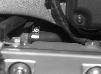 Remove actuating control for reverser. Remove engine spoiler. Remove left and right skirt brackets. Remove tank cover with the control unit for the radio. Remove fuel tank. Remove the intake air pipe.