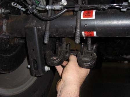 4WD: Lower axle enough to remove factory block. 8.