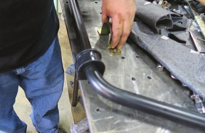 Install a 3/8 Flat Washer on (4) 3/8-16 x 1 1/4 Hex Bolts and insert them into the holes.