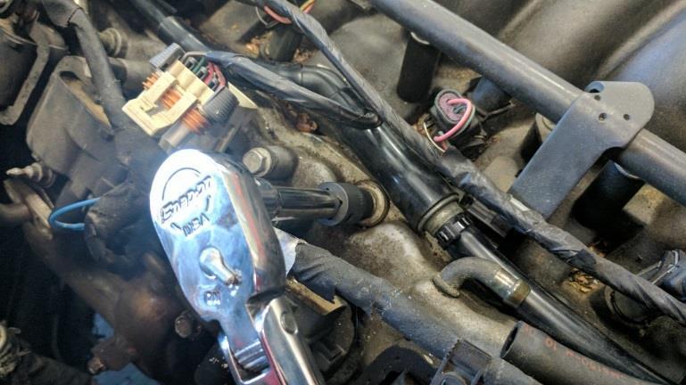 01-04 Vehicles: The entire coil pack harness and coil packs must be removed from the valve cover to gain access to