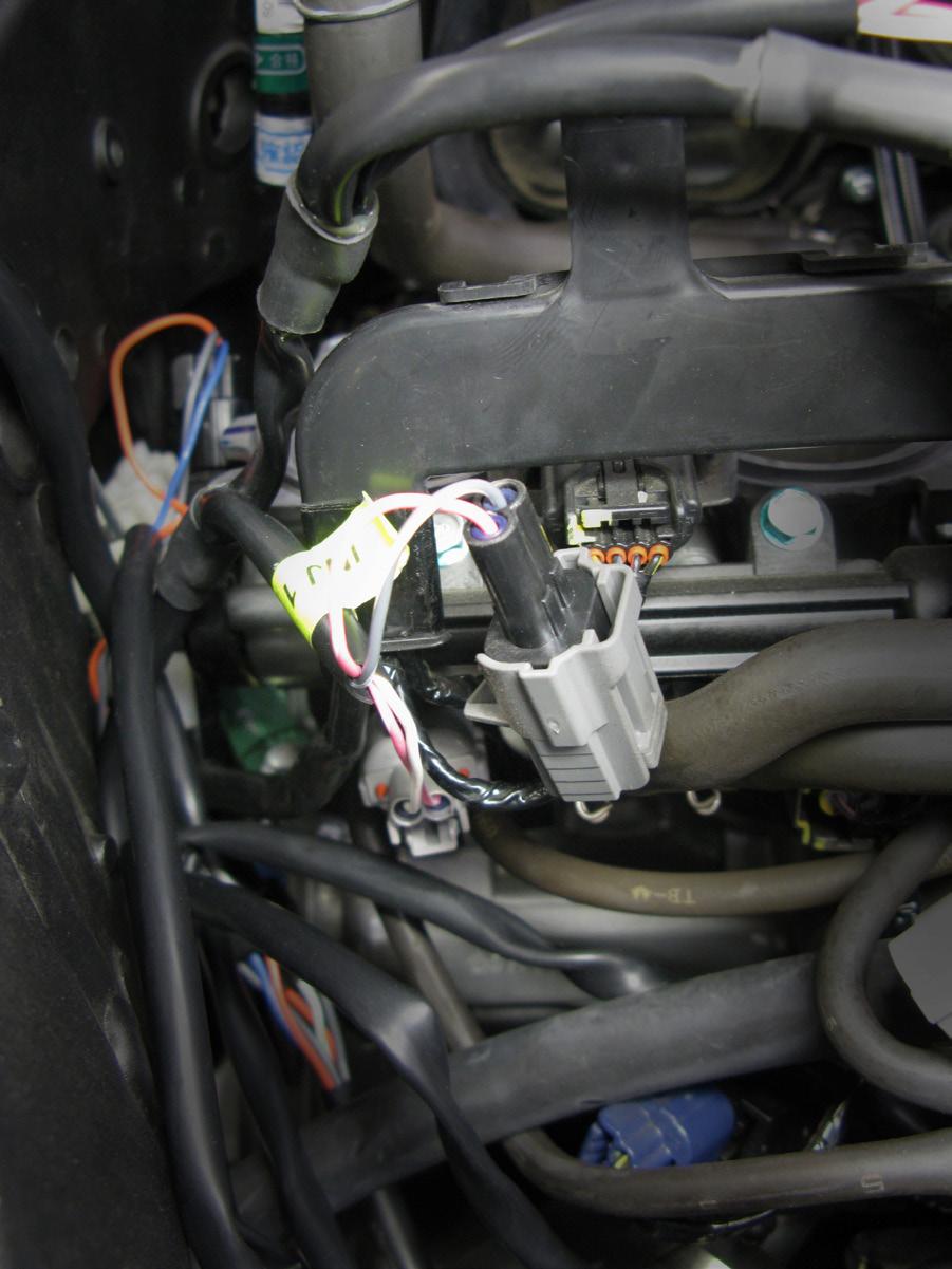 5>CONNECT (CONT.) 5.2 1. Route the Bazzaz fuel harness to the engine compartment. 2. Locate the lower fuel injectors (lower injector 1 shown in photo). 3.