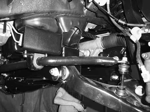 Install tie rod ends to the knuckles from top-down. Torque to 111 ft-lbs. 47. Install the wheels and lower the vehicle to the ground. 48. Bounce the front of the vehicle to settle the suspension.