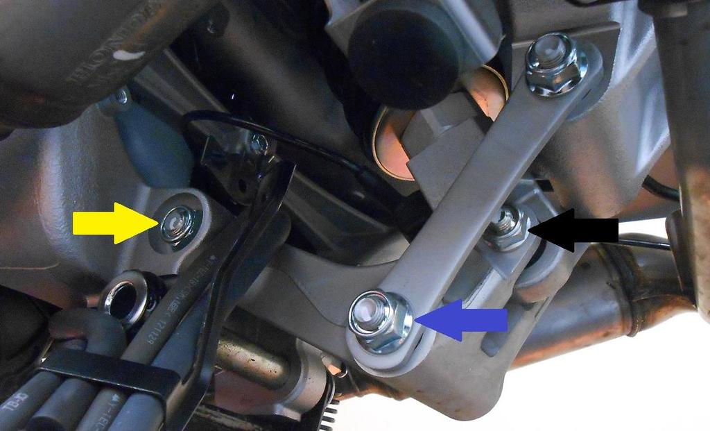 55. Remove the lower linkage arm bolt BLUE ARROW. 56. Remove the lower shock bolt BLACK ARROW. 57.
