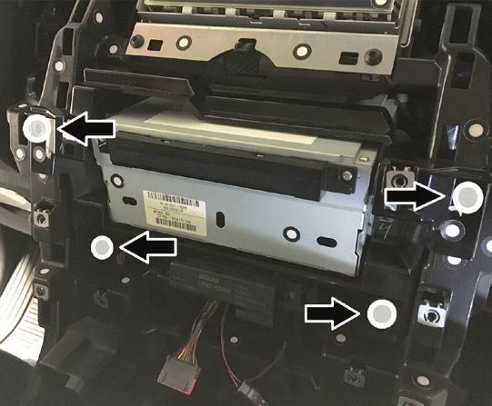 DASH DISASSEMBLY (CONT.) 6. Pull up and back to unclip the panel to the left side of the radio.