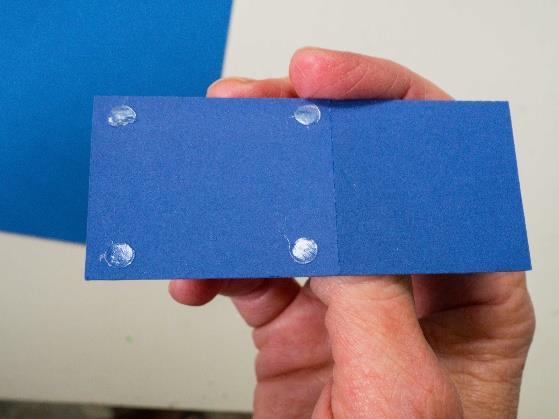 Lay the pattern for the stems over the blue 5x7 inch card.