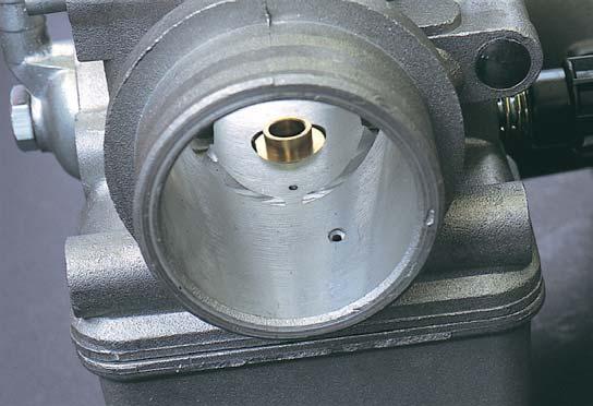 the left, or flat on the right). Below, with the throttle valve partially lifted, we can notice the arrangement of the progression port. when the driver starts to open the throttle.