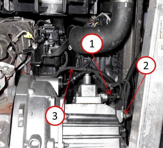 08-039-16 REV. A -10-6. Remove the splash shield from underneath the vehicle. 7. Remove the ground nut from transmission to the wiring harness (Fig. 9). 8.
